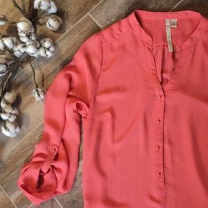 Cute peach top with gold buttons down the front.